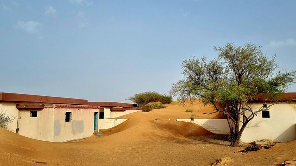 The Ghost Village Safari Tour with Dune Bashing and Sandboarding