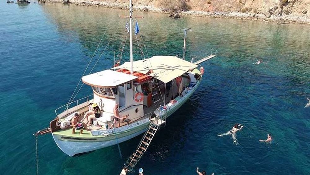 White Rocks Beach, Xi Beach, and Vardiani Island Day Cruise